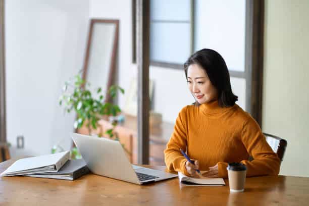 asian woman studying for qualifications